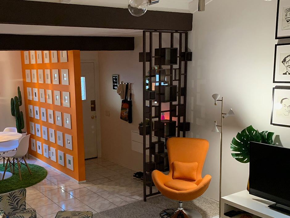 Create a mid-century modern room divider from wall shelves and a DIY wood frame