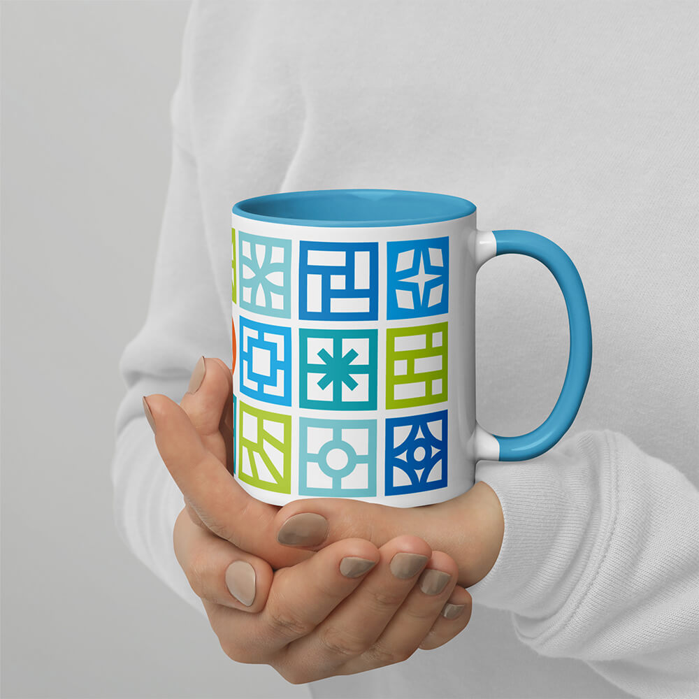 Mid Century Modern Cool Breeze Blocks 11oz Mug with Color Inside held by a girl