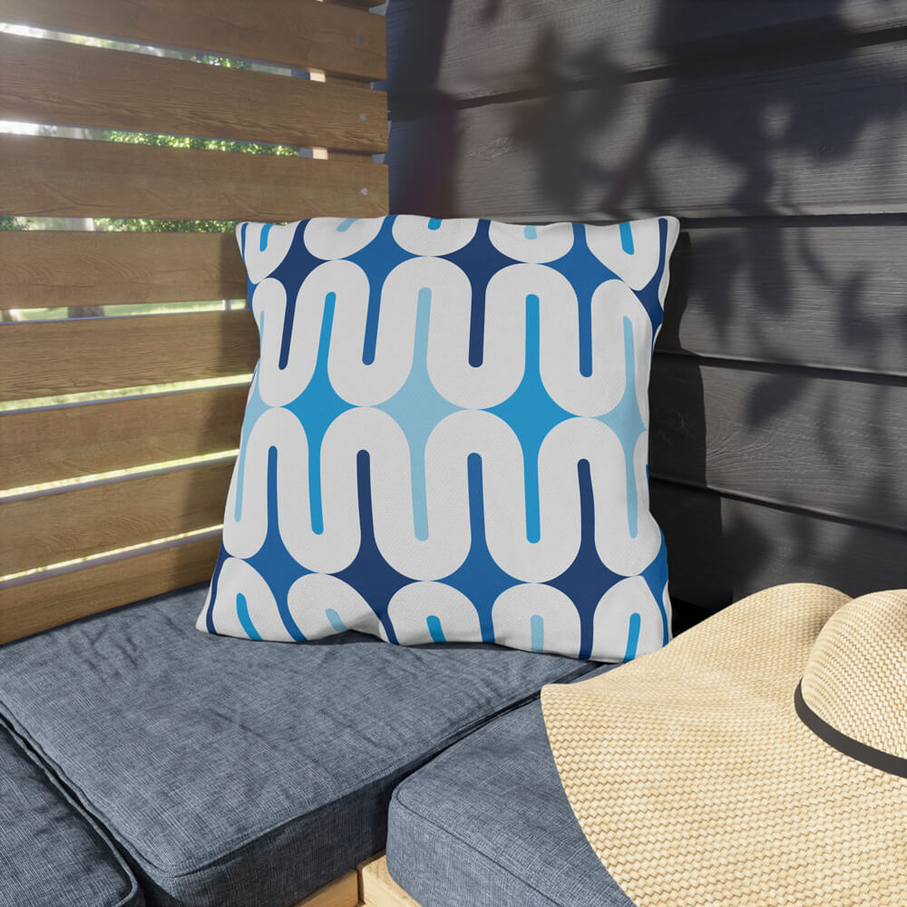 Mid Century Modern Blue Galaxie 18" Outdoor Pillow on a bench