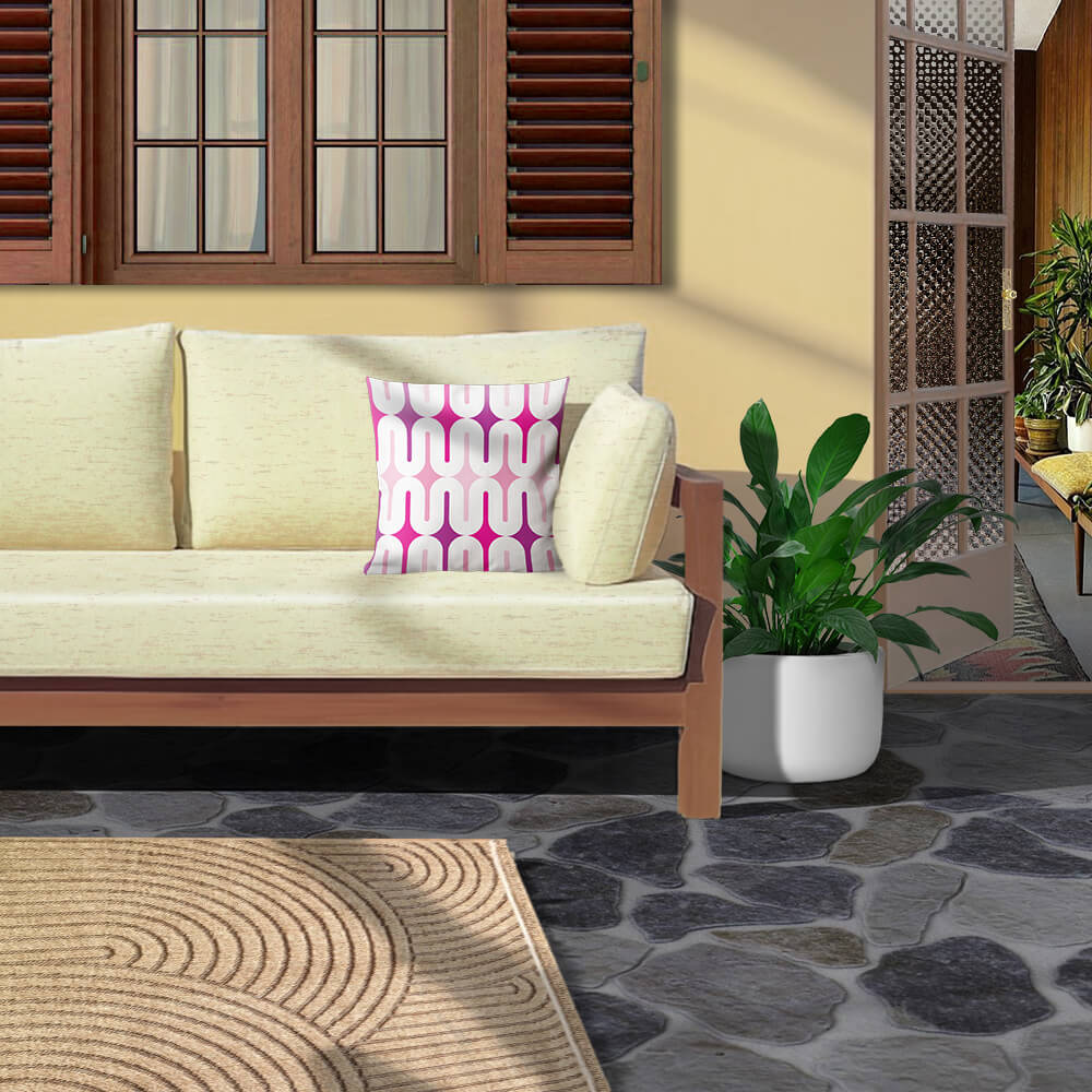 Mid Century Modern Pink Galaxie 18" Outdoor Pillow on a patio sofa