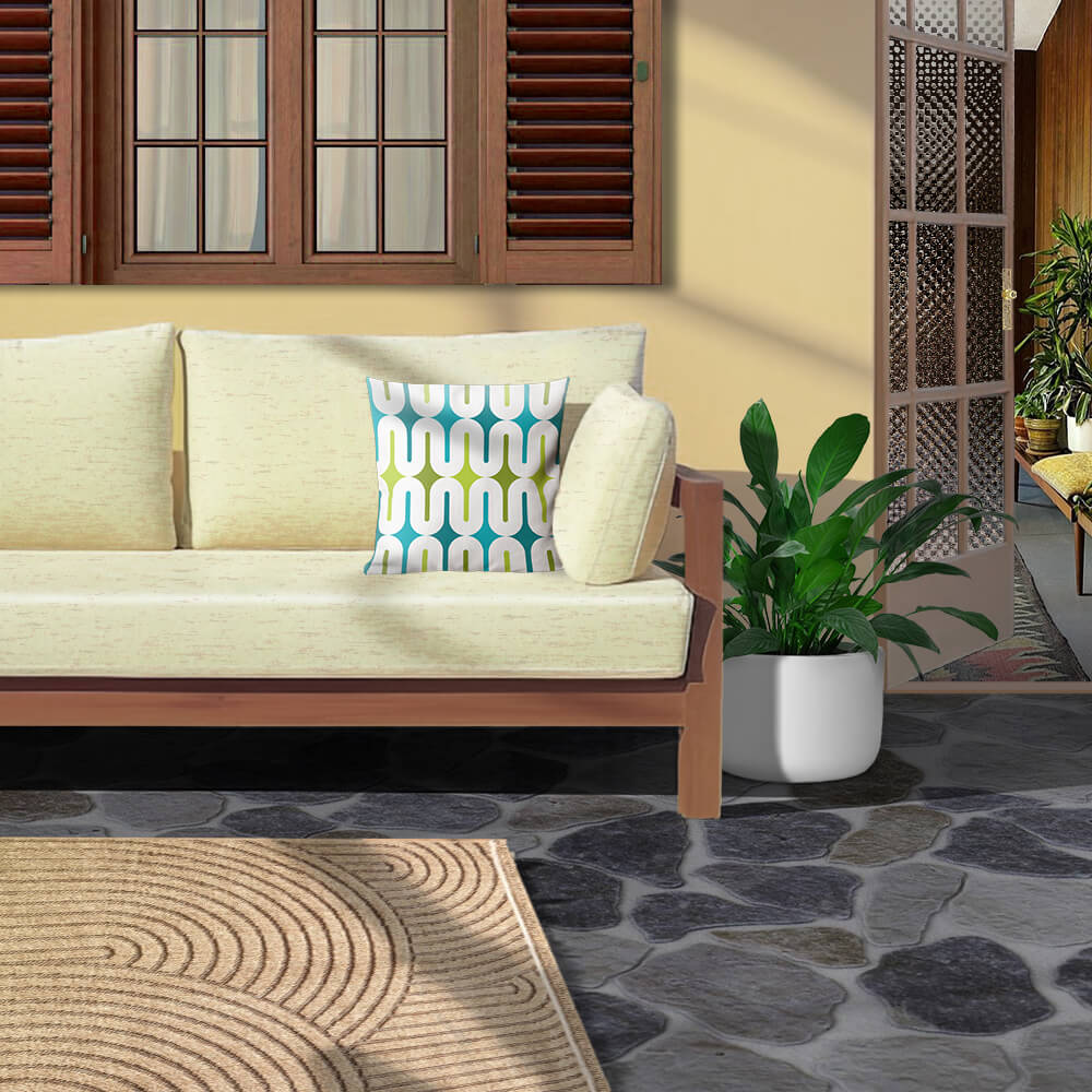 Mid Century Modern Aqua Green MilkyWay 18" Outdoor Pillow on a patio