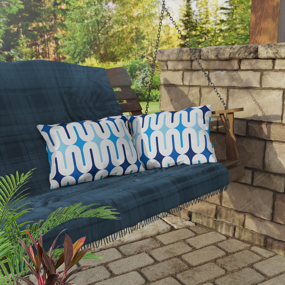 Two Mid Century Modern Blue Galaxie 20" x 14" Outdoor Pillow on a swing bench