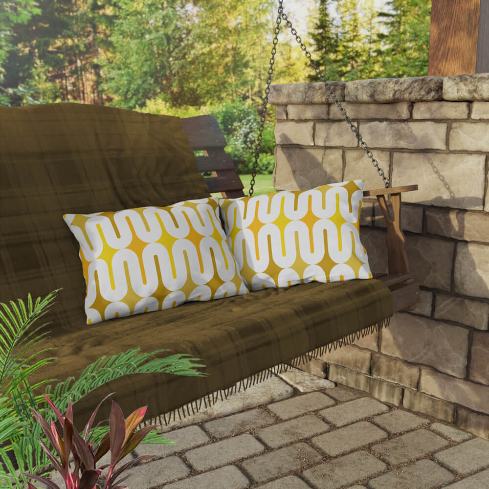 Two Mid Century Modern Yellow Galaxie 20" x 14" Outdoor Pillow on a swing bench