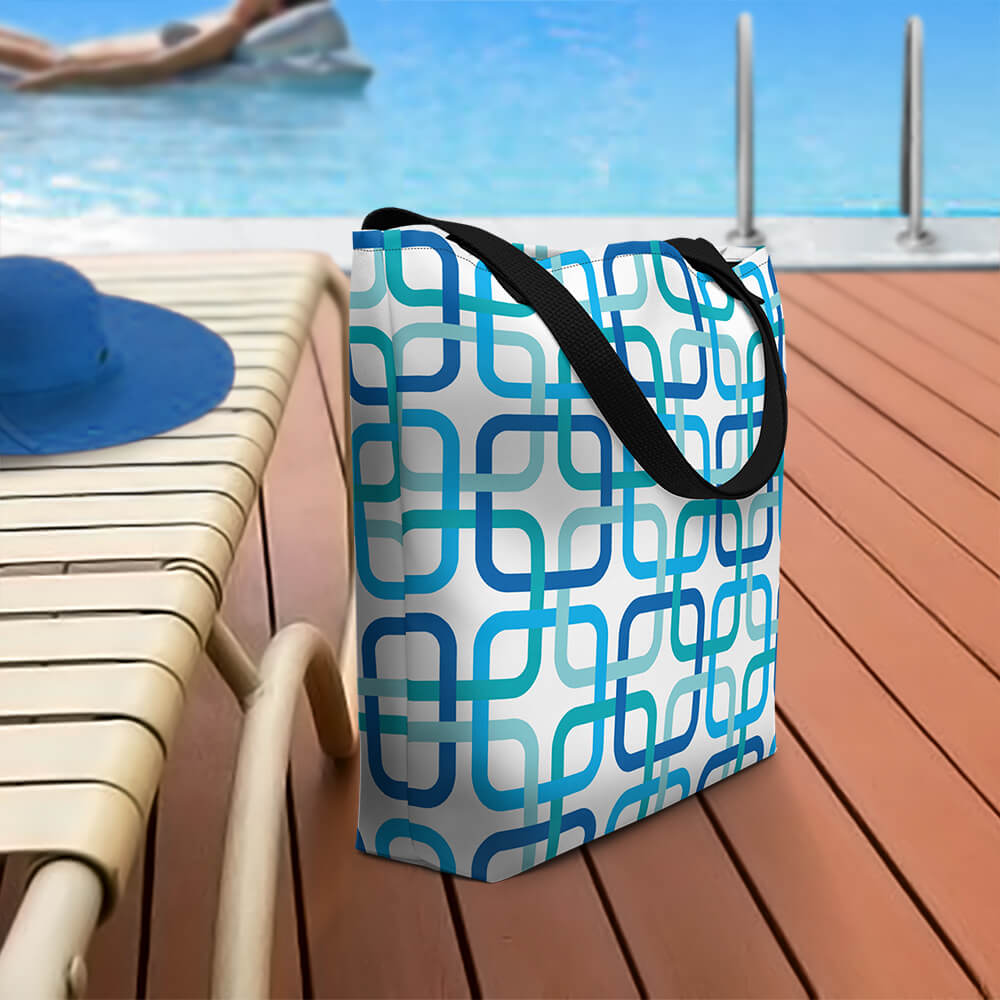 Mid Century Modern Blue PanAmTrays Beach Bag on a patio deck