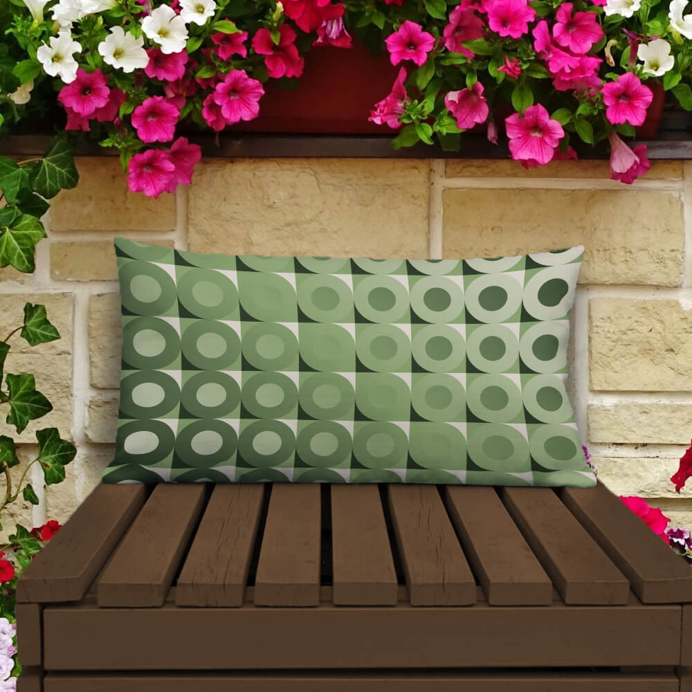 Mid Century Modern Camel Green LifeSavers 20" x 12" Rectangular Throw Pillow on a patio bench