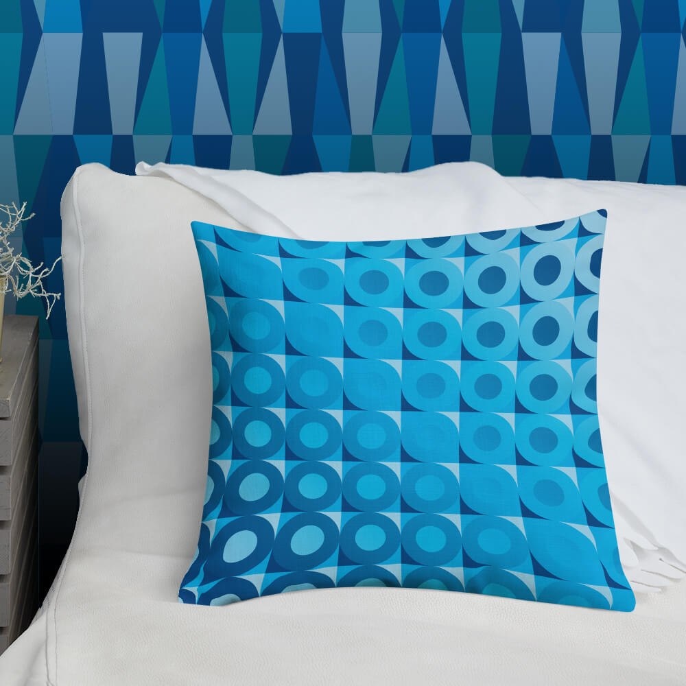 Mid Century Modern Blue LifeSavers 18" Square Throw Pillow on a bed