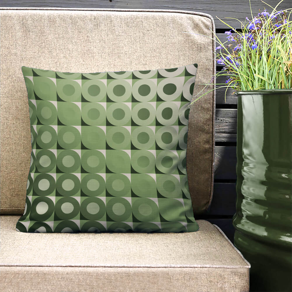 Mid Century Modern Camel Green LifeSavers 18" Square Throw Pillow on a patio bench