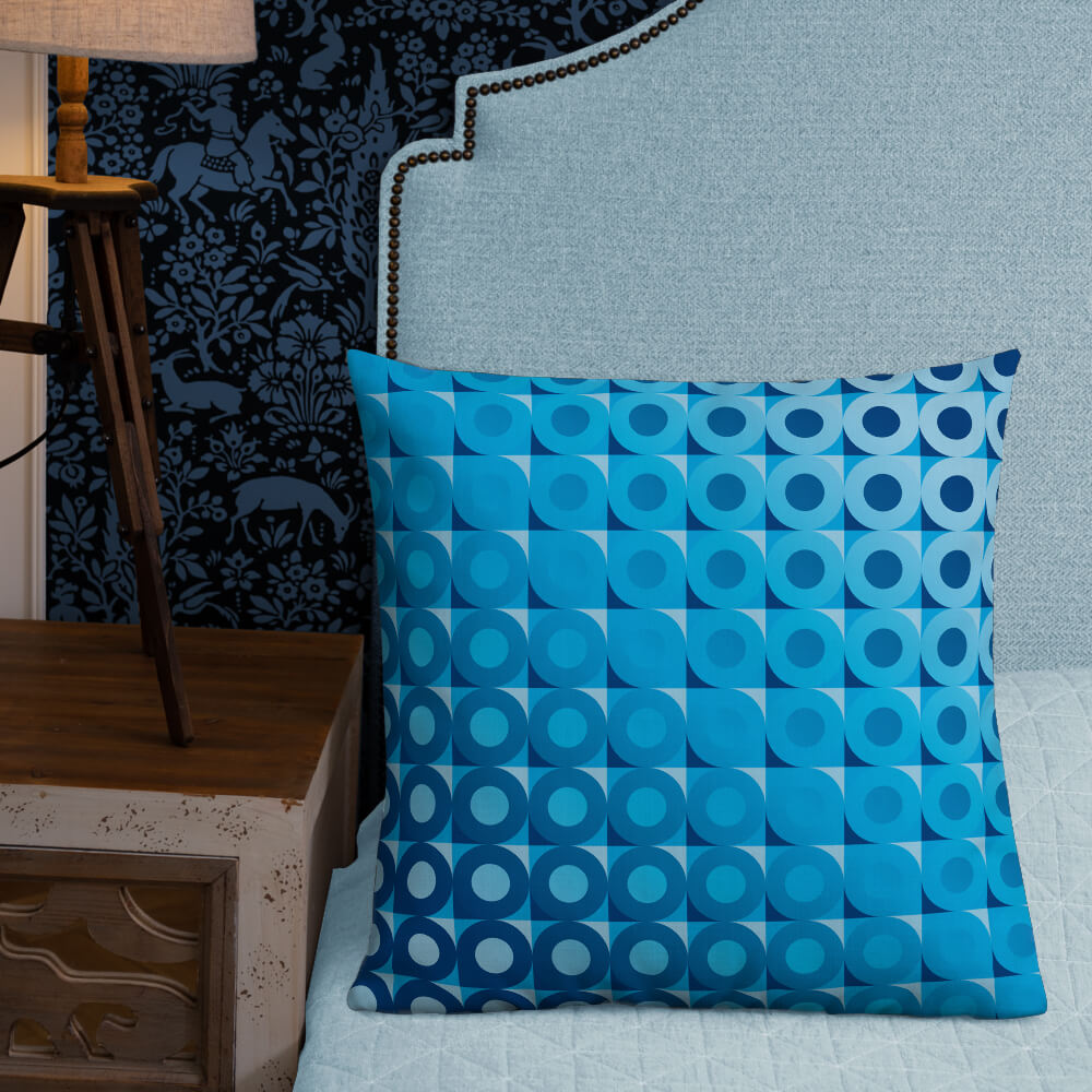 Mid-century Modern Blue LifeSavers 22" Square Throw Pillow on a bed