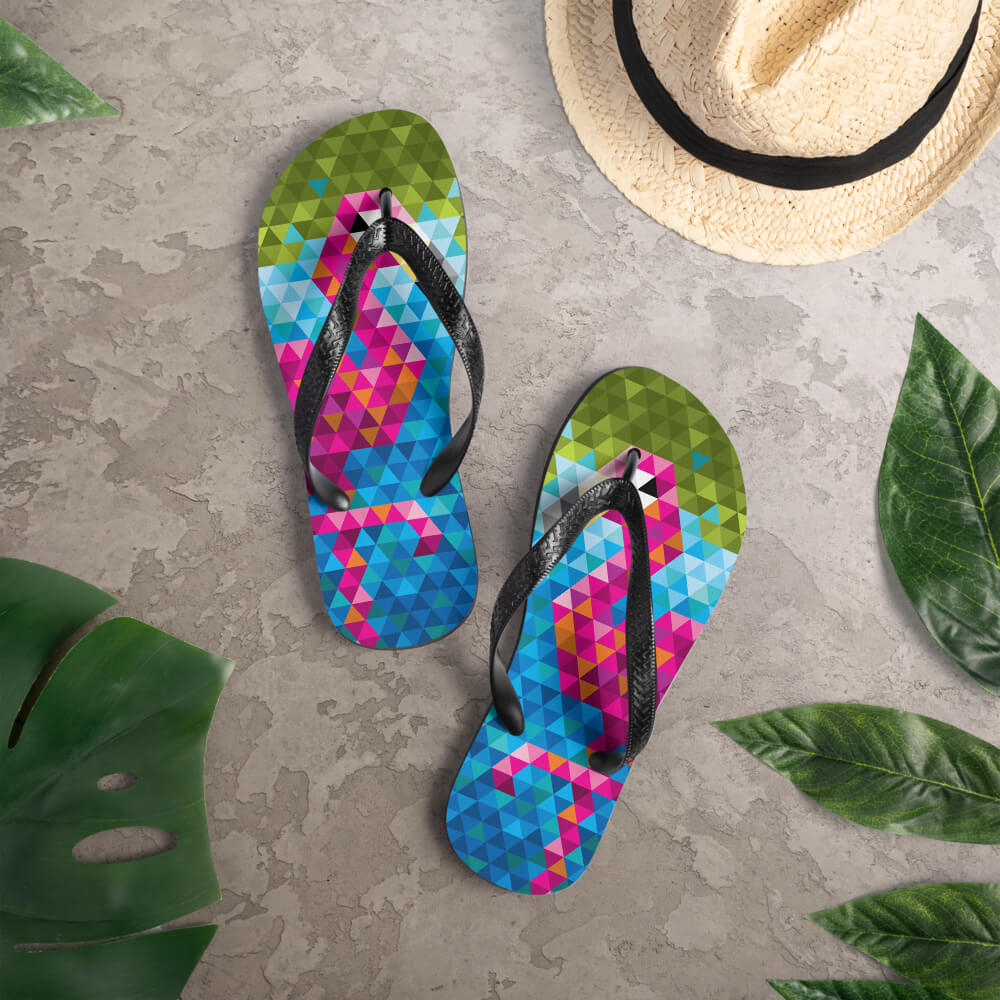 Mid Century Modern Flamingo Flip-Flops on a deck
