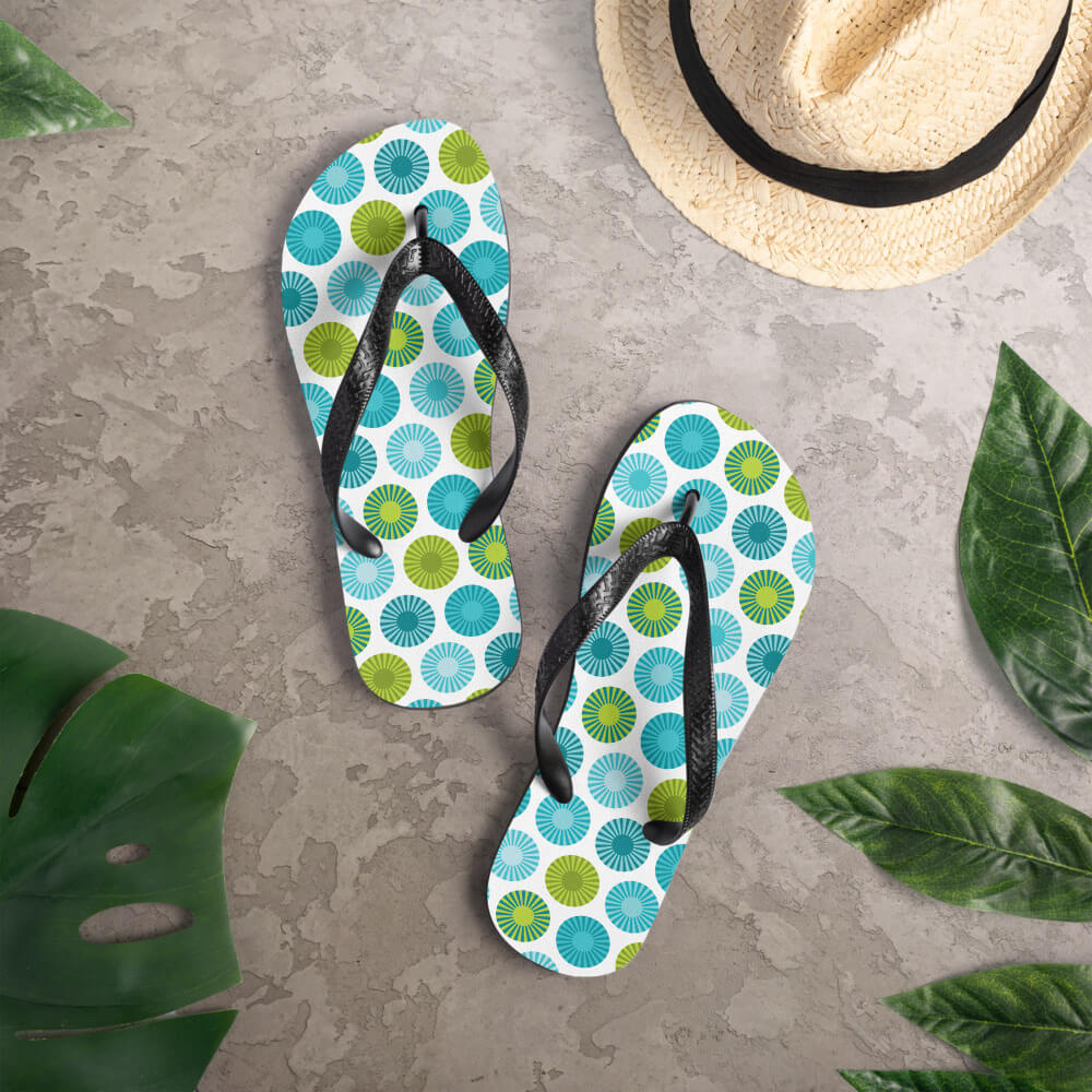 Mid Century Modern Aqua FlowerPower Flip-Flops on a deck