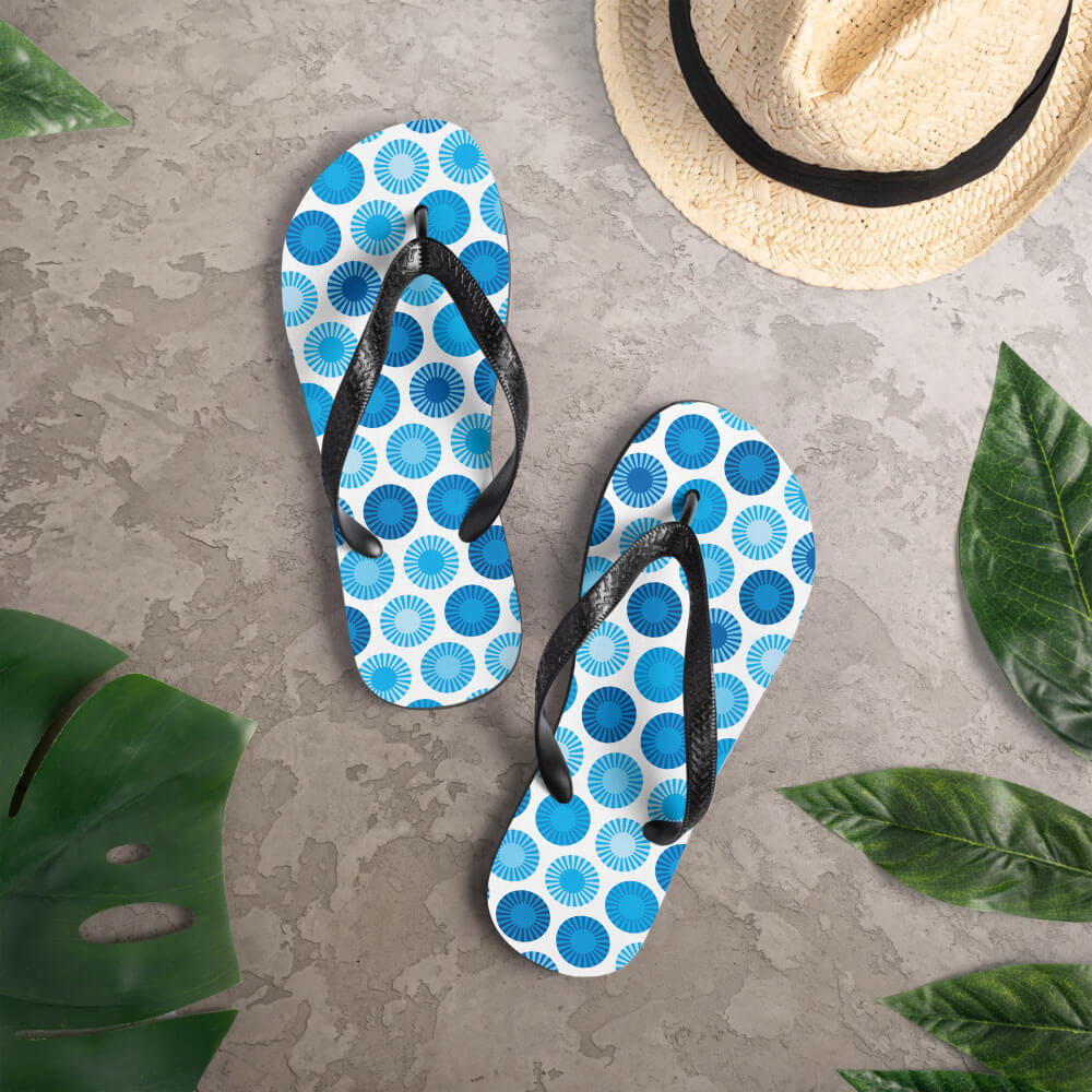 Mid Century Modern Blue FlowerPower Flip-Flops on a deck
