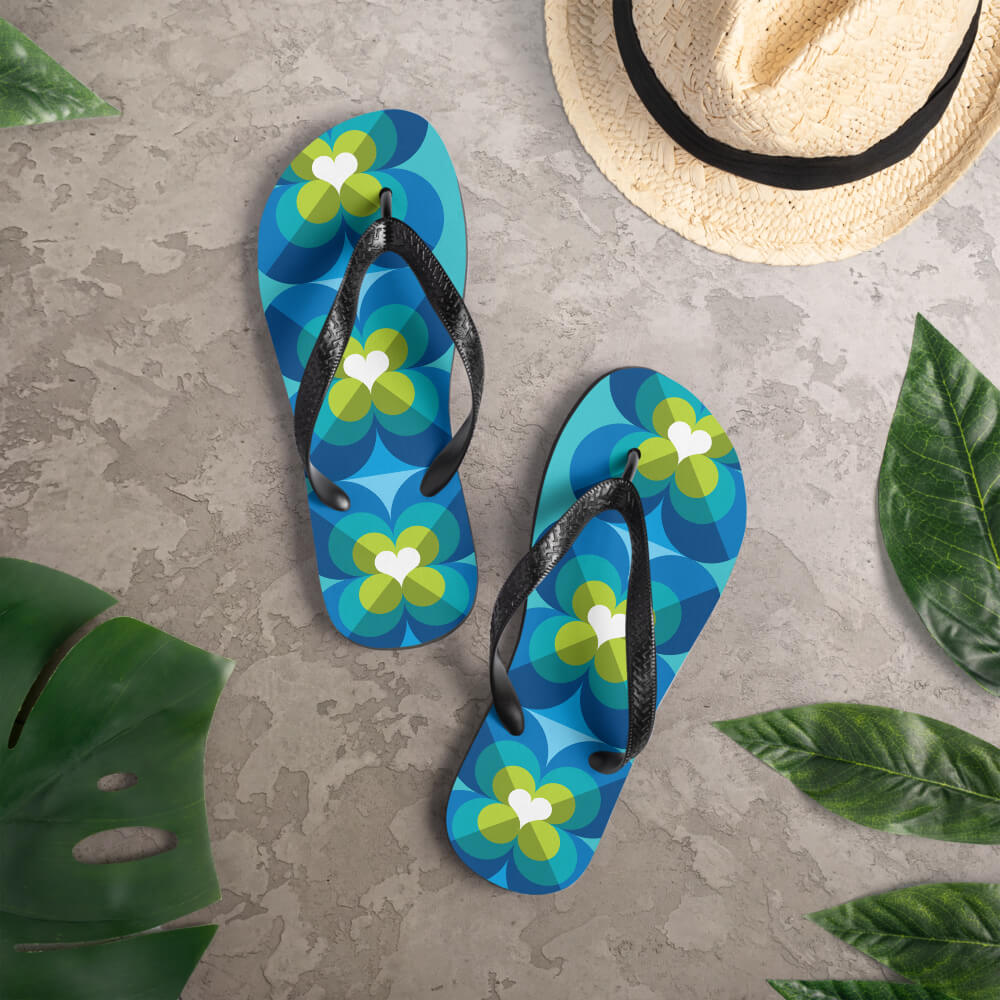 Mid Century Modern Aqua Blue LoverLeaf Flip-Flops on a deck