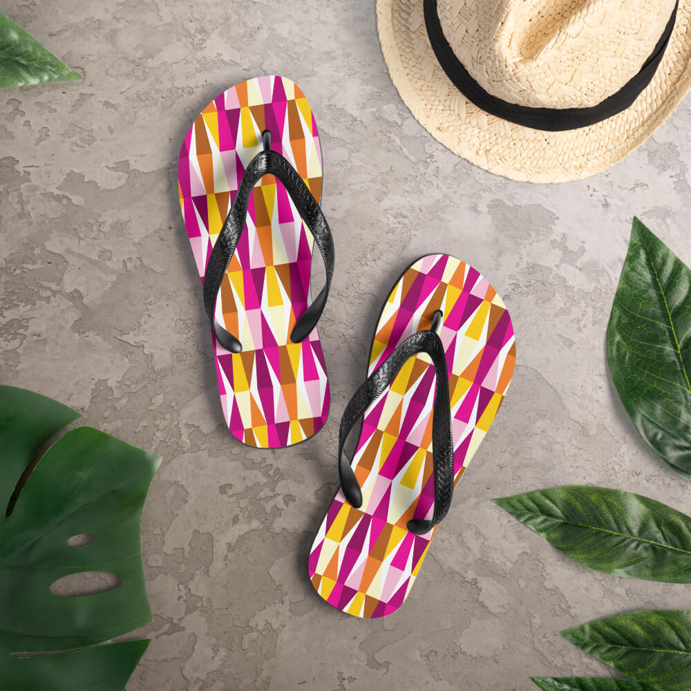 Mid Century Modern Orange Pink LozAnges Flip-Flops on a deck