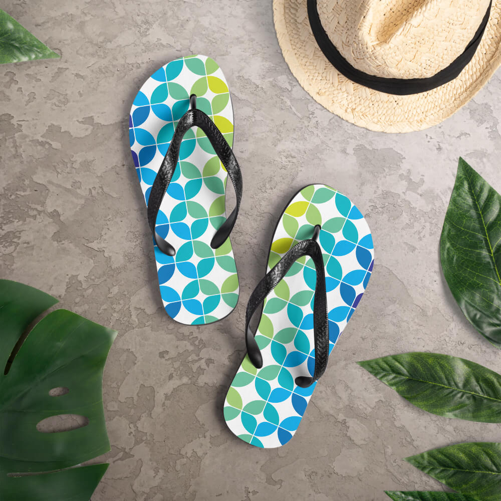 Mid Century Modern Blue Aqua StarChips Flip-Flops on a deck