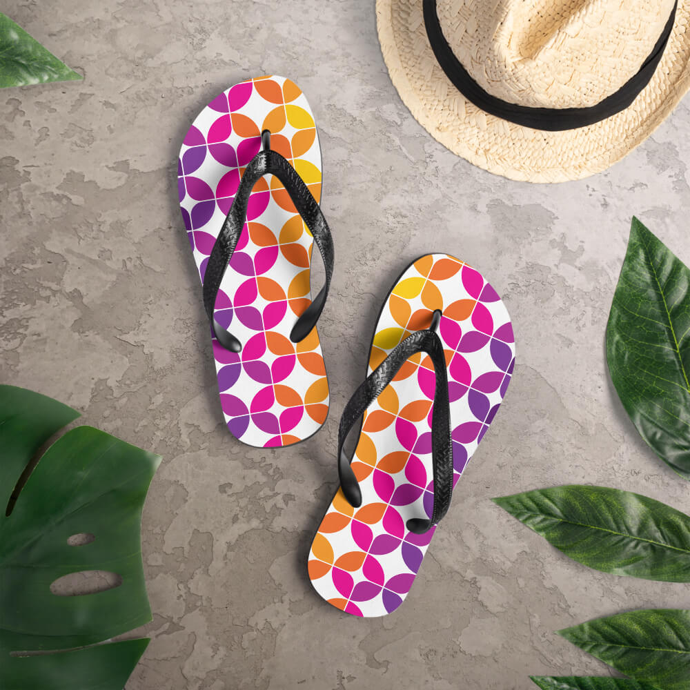 Mid Century Modern Purple Orange StarChips Flip-Flops on a deck