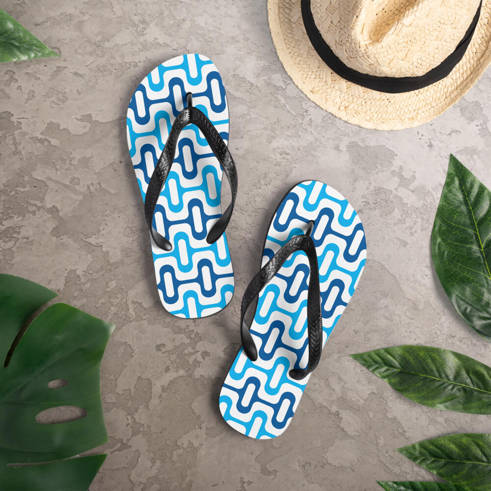 Mid Century Modern Blue ZipperDee Flip-Flops on a deck