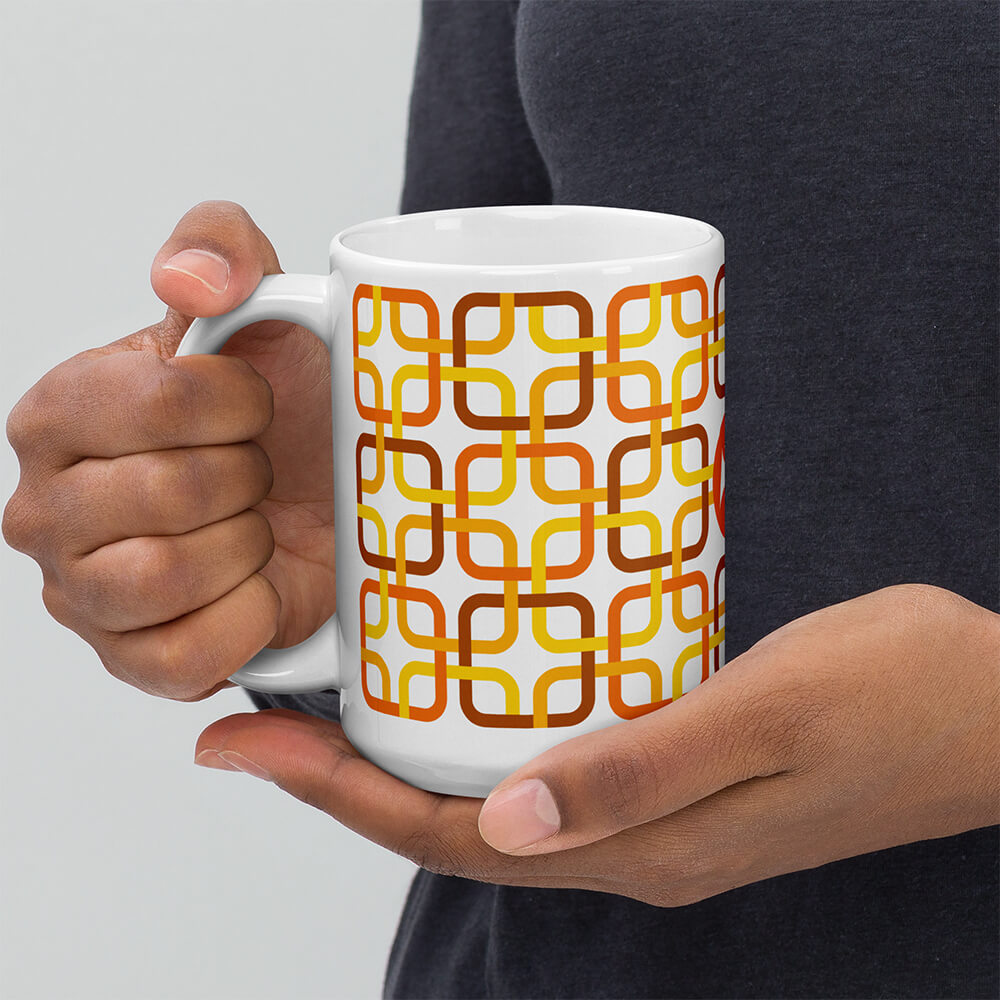 Mid Century Modern Orange PanAmTrays 15oz Mug in the hands of a man