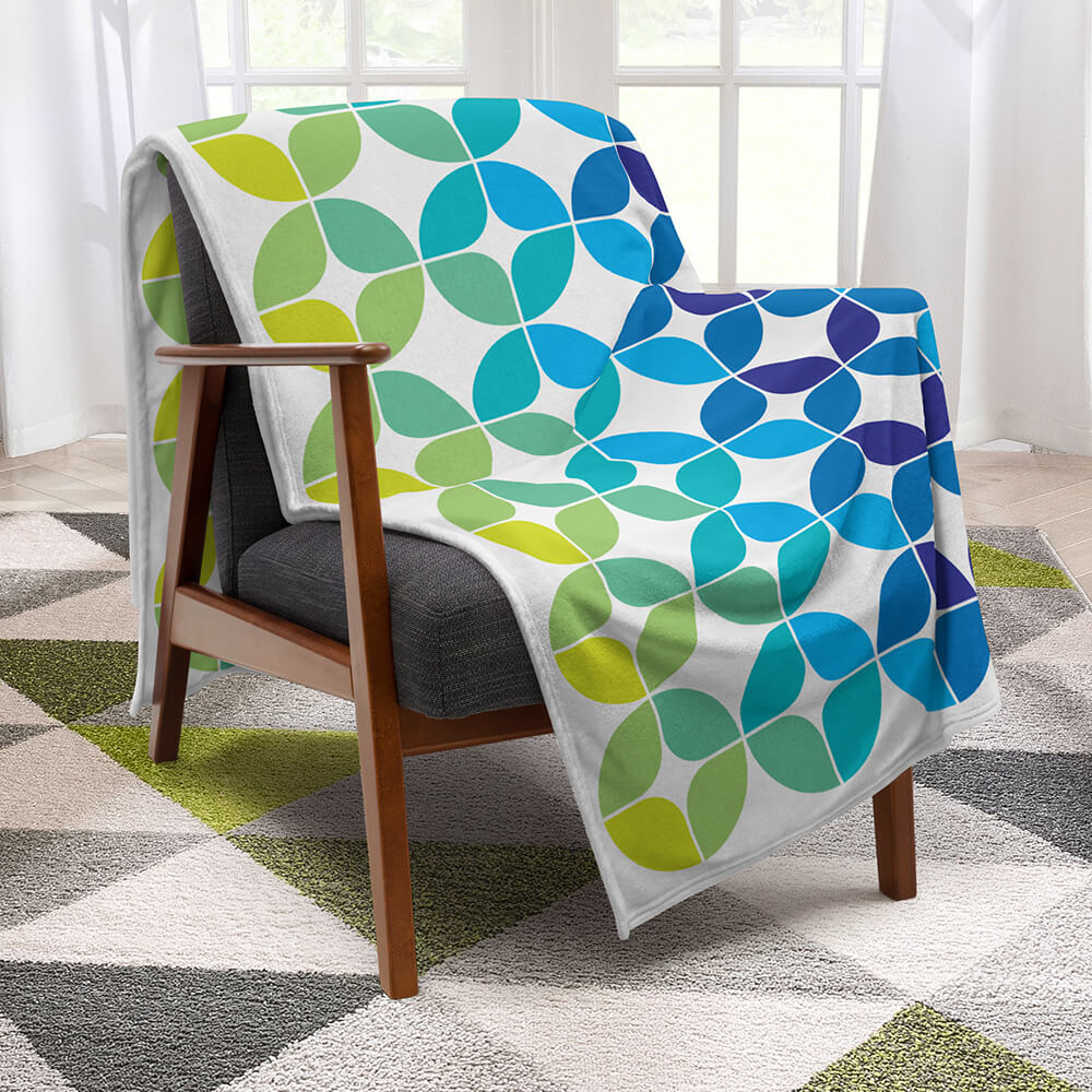 Mid Century Modern Blue Aqua StarChips 60" x 80" Throw Blanket on a midmod chair