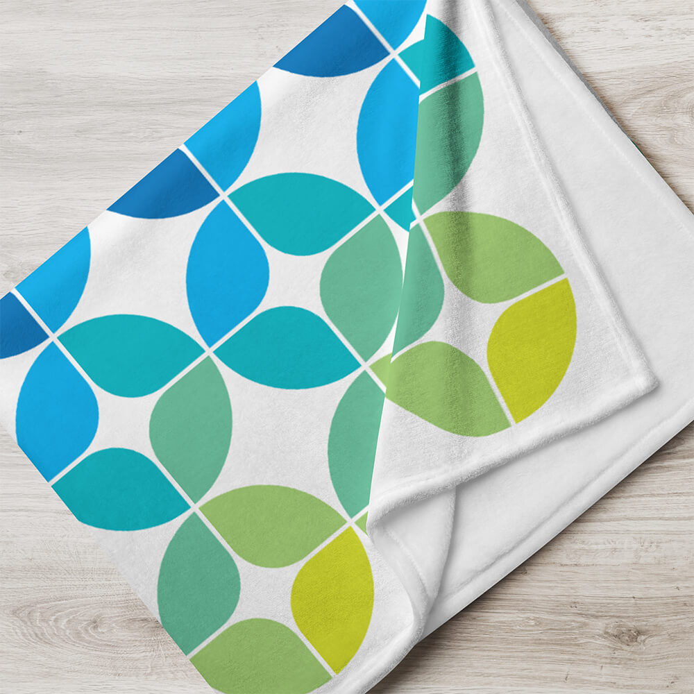 Mid Century Modern Blue Aqua StarChips 60" x 80" Throw Blanket folded on the floor