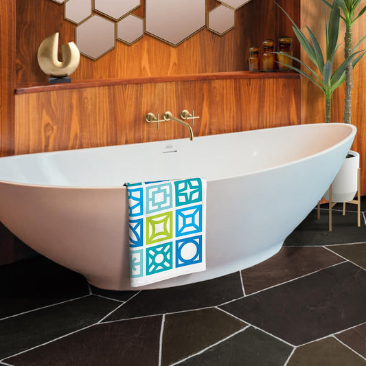 Mid Century Modern Blue Breeze Blocks Beach & Pool Towel in a bathroom