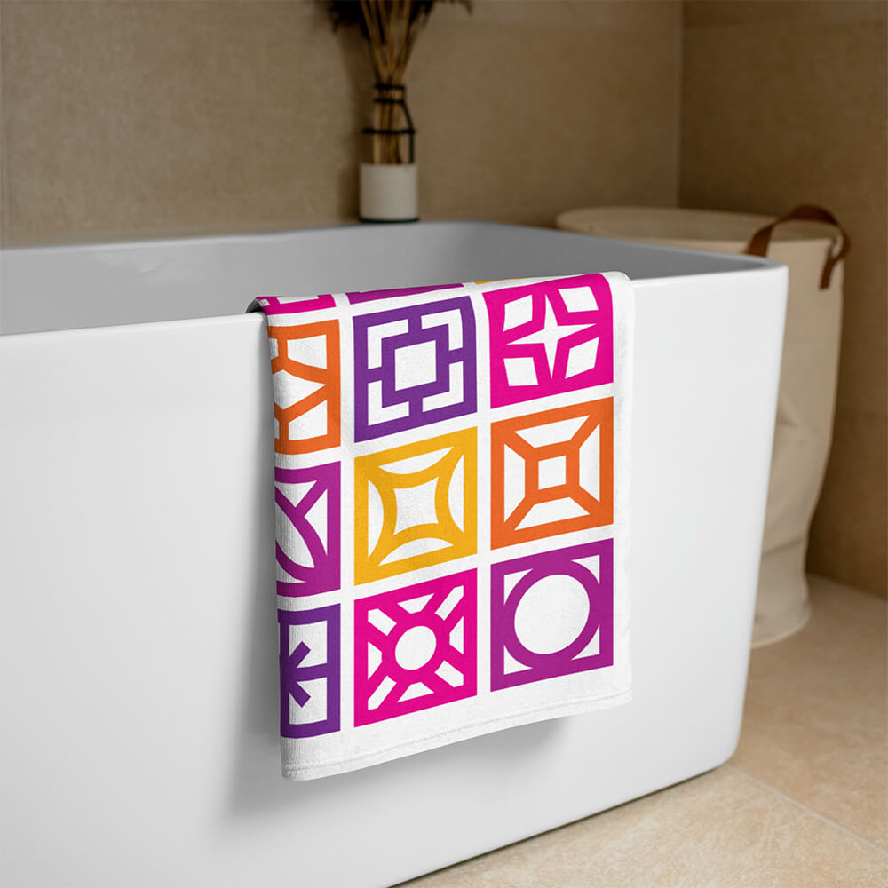 Mid Century Modern Orange Breeze Blocks Beach & Pool Towel on a bathtub