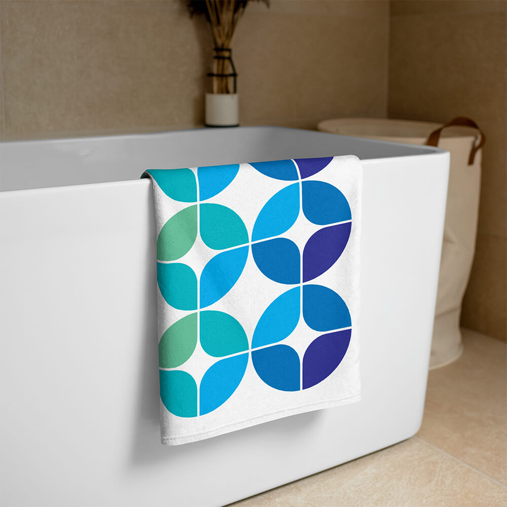 Mid Century Modern Blue Aqua StarChips Beach & Pool Towel on a bathtub