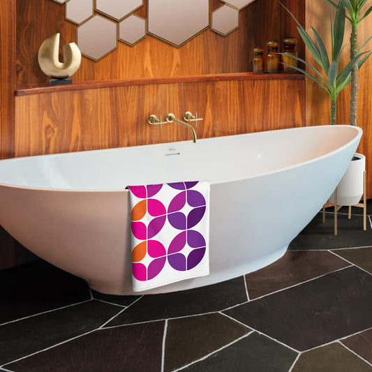 Mid Century Modern Purple Orange StarChips Beach & Pool Towel in a bathroom