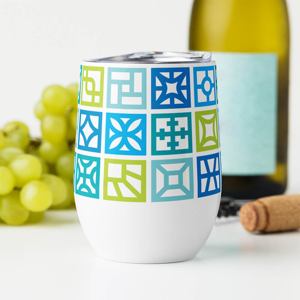 Mid Century Modern Blue Breeze Blocks 12 oz Stainless Steel Designer Wine Tumbler on a table with grapes