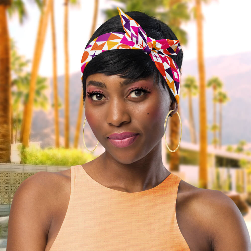 Mid Century Modern Orange Starzl Bandana as a headband on a girl