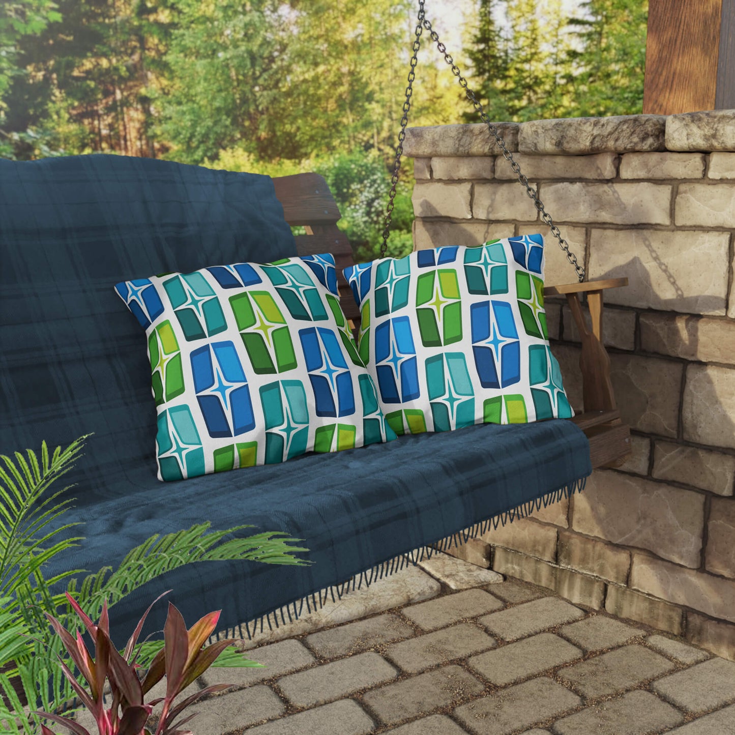Mid Century Modern Blue Aqua AstroShields 18" Square Outdoor Pillow on a swing bench