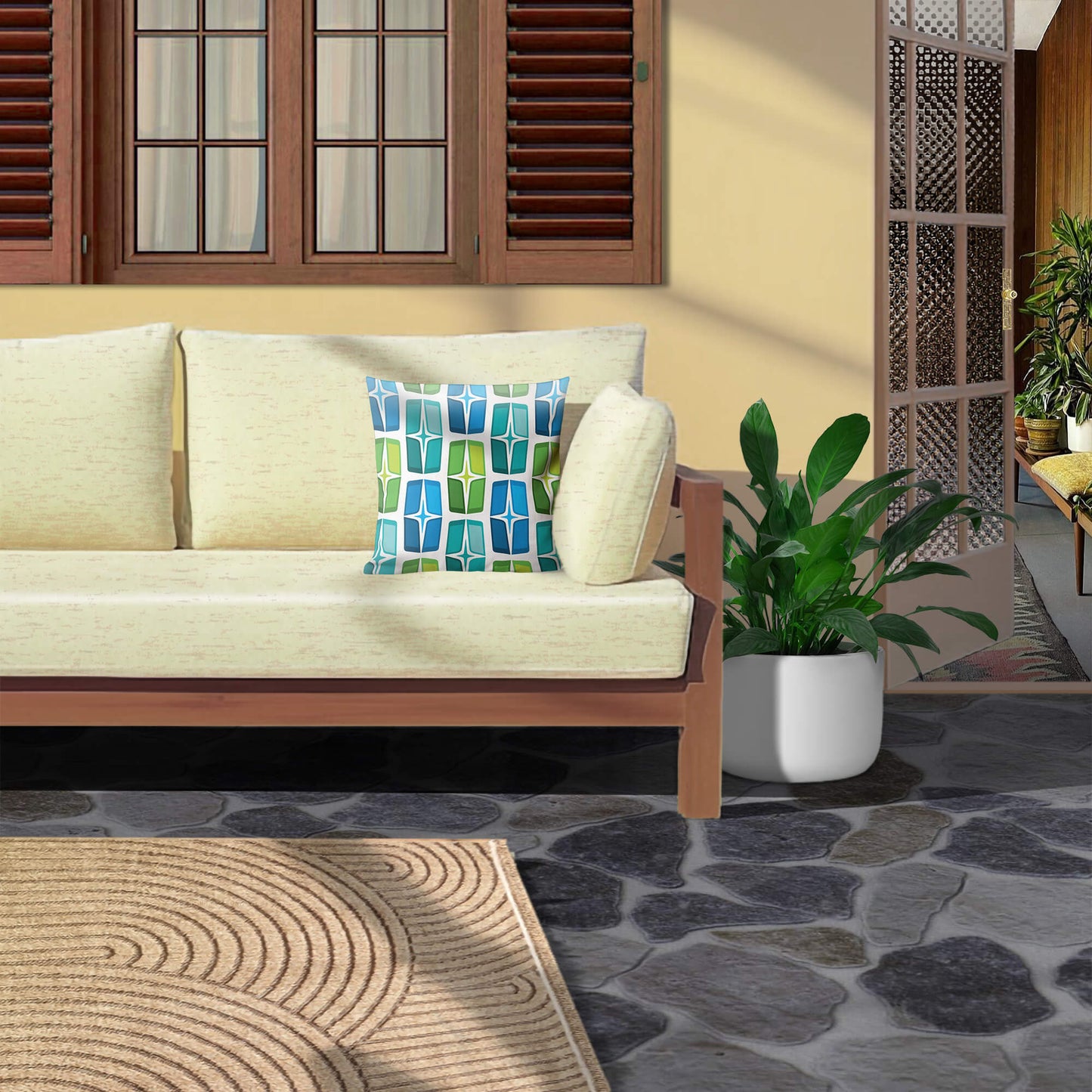 Mid Century Modern Blue Aqua AstroShields 18" Square Outdoor Pillow on a patio sofa