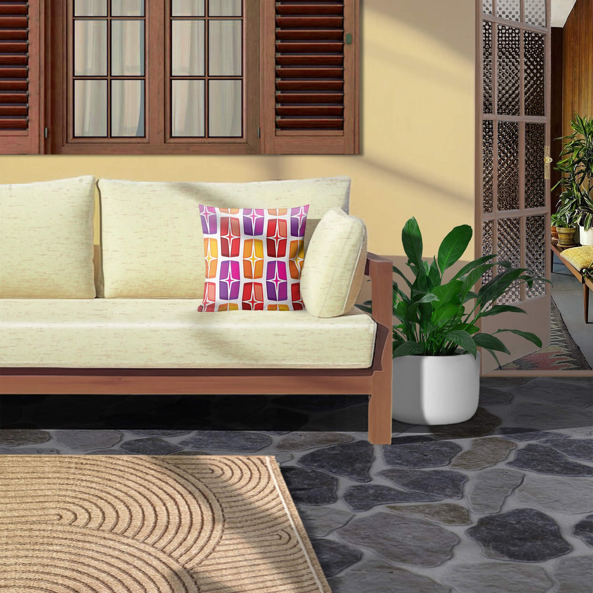 Mid Century Modern Orange Purple AstroShields 18" Square Outdoor Pillow on a sofa