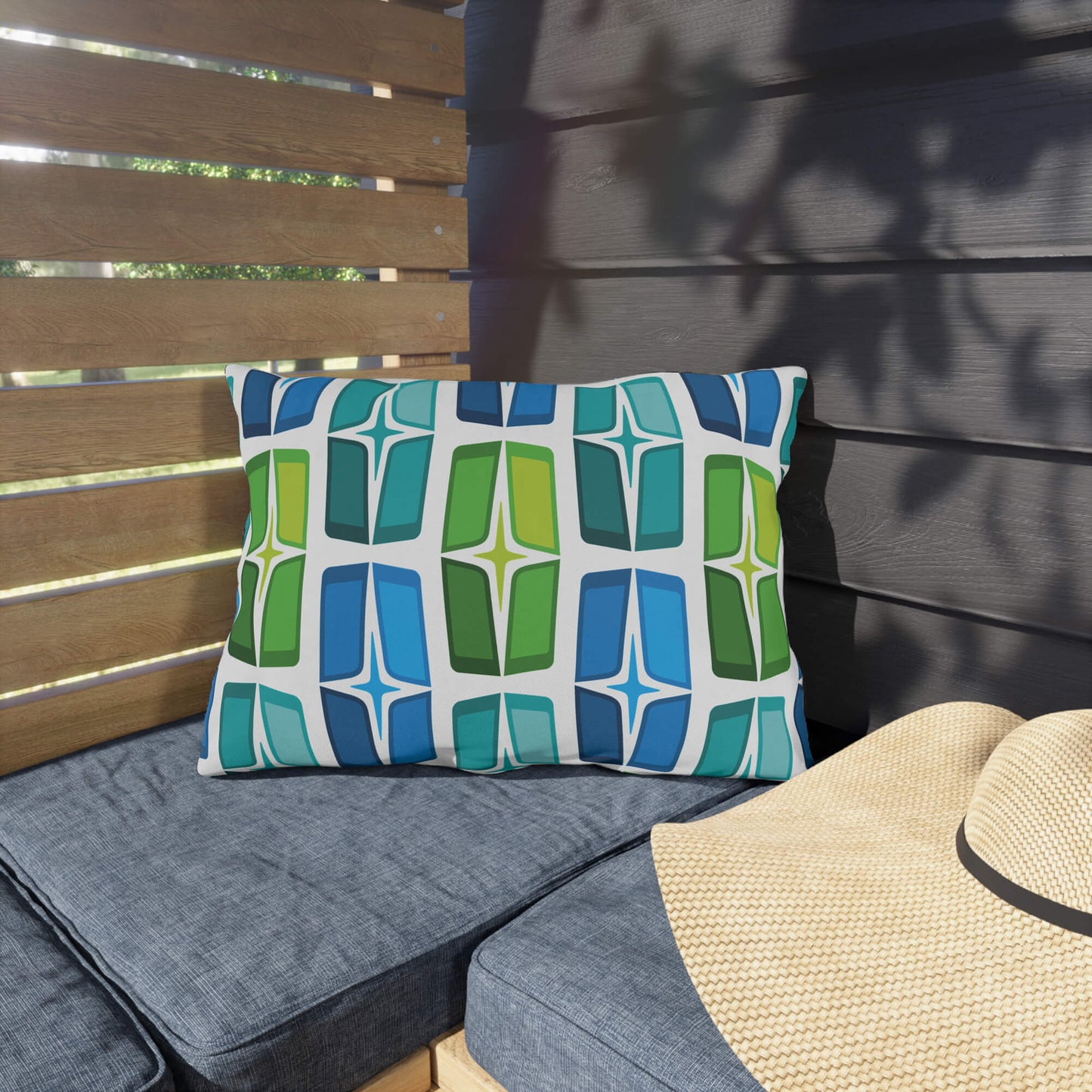 Mid Century Modern Blue Green AstroShields 20" x 14" Rectangular Outdoor Pillow on a bench