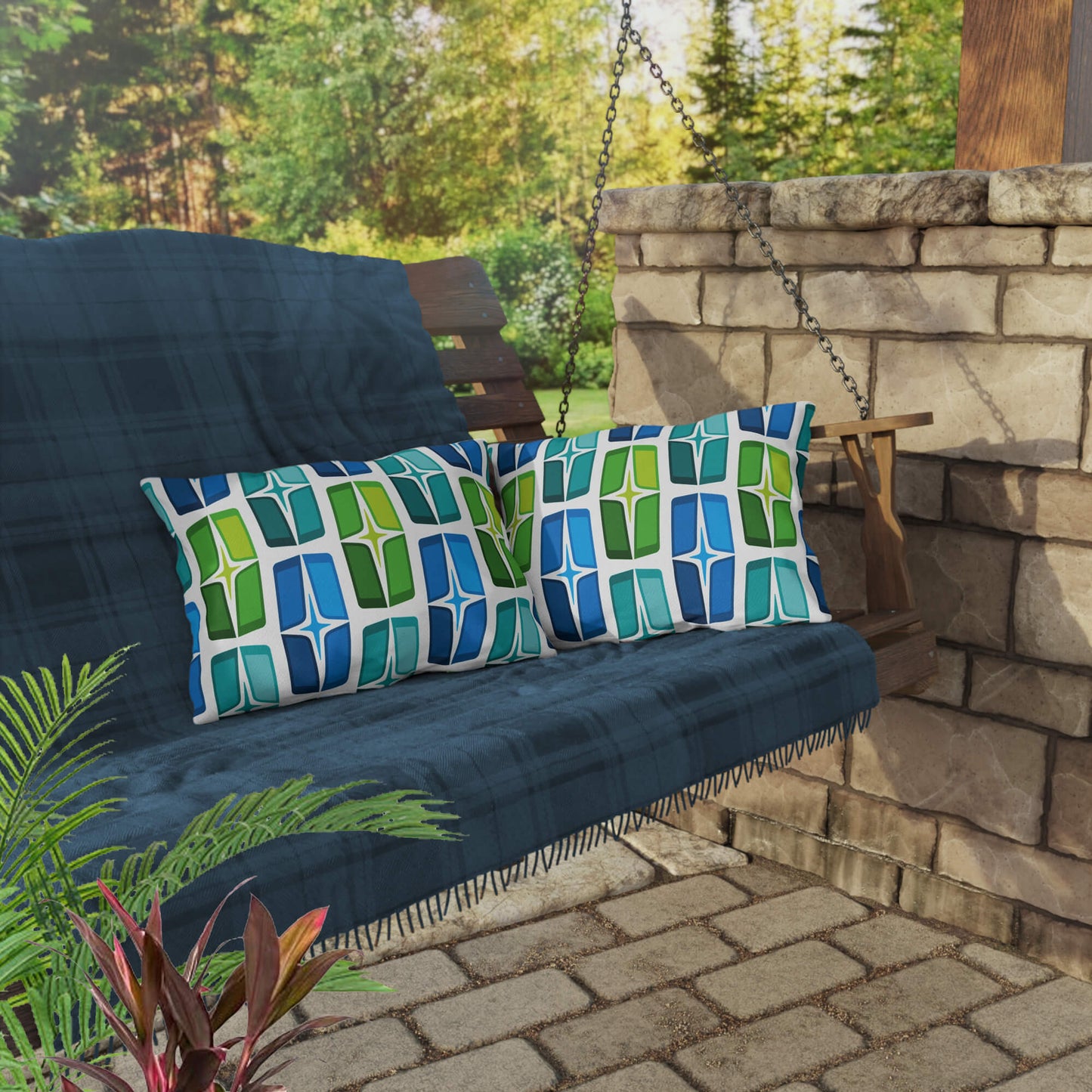Mid Century Modern Blue Green AstroShields 20" x 14" Rectangular Outdoor Pillow on a swing bench
