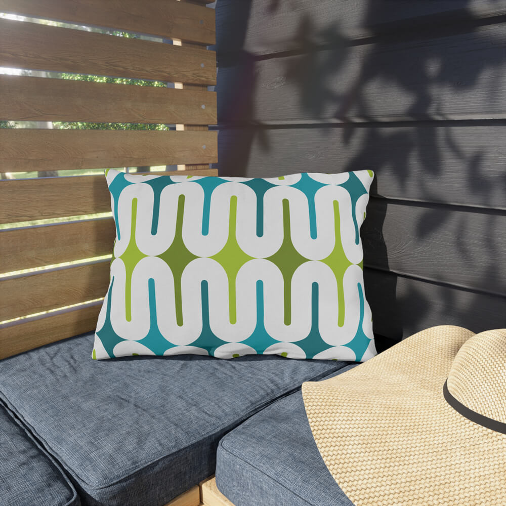 Mid Century Modern Aqua Green Galaxie 20" x 14" Outdoor Pillow on a bench