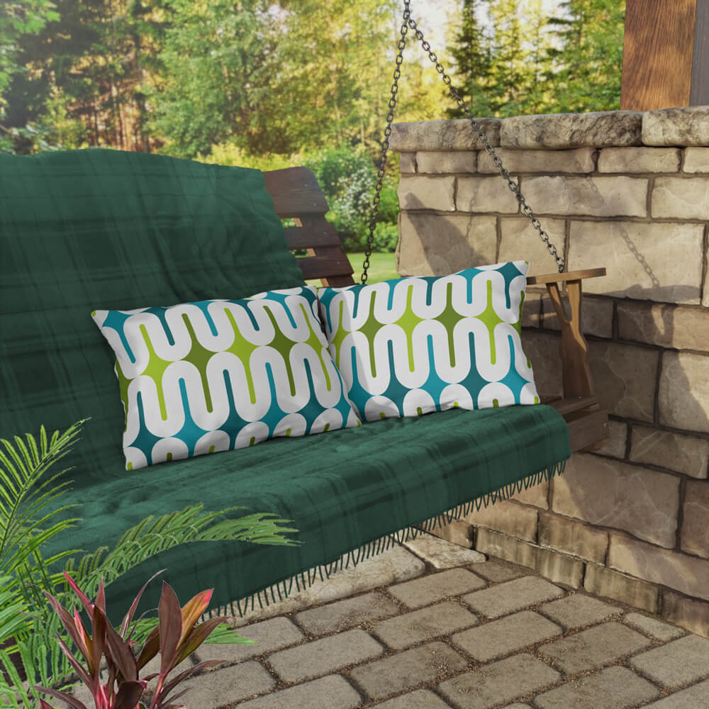 Two Mid Century Modern Aqua Green Galaxie 20" x 14" Outdoor Pillow on a swing bench