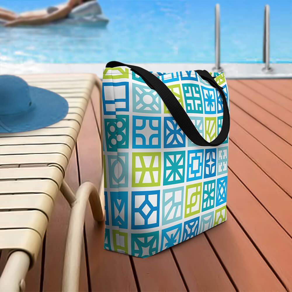 Mid Century Modern Blue Breeze Blocks Beach Bag on a pool deck