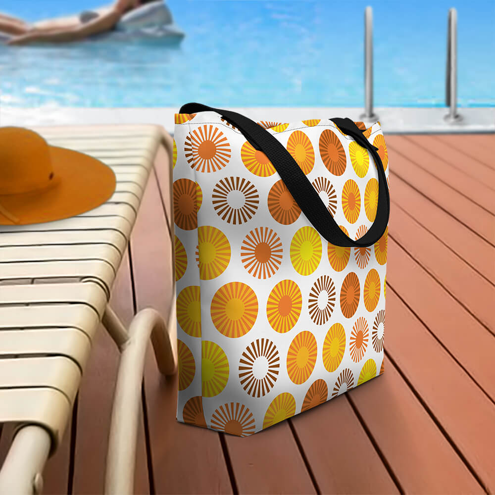 Mid Century Modern Orange FlowerPower Beach Bag on a pool deck
