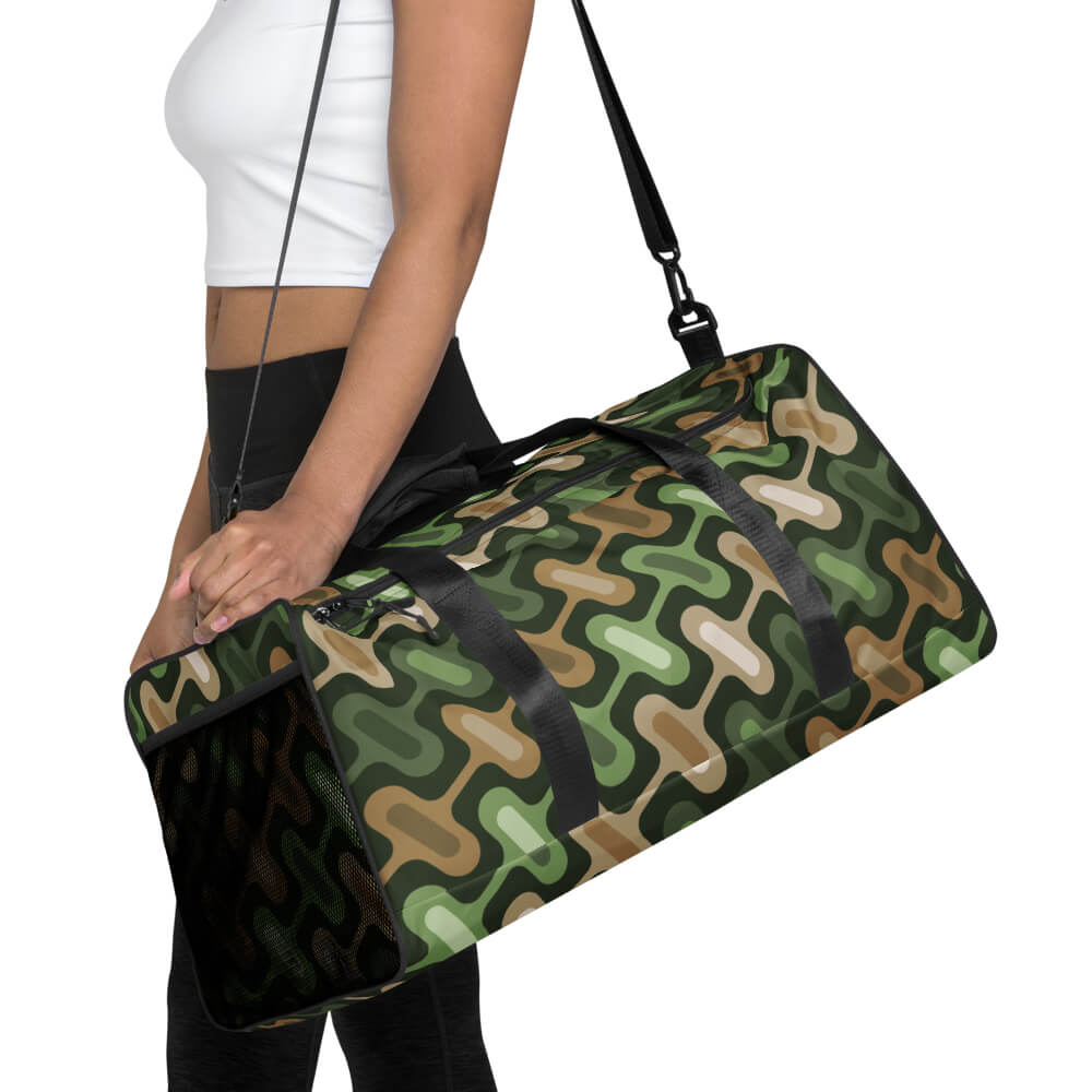 Mid Century Modern Camo ZipperDee Duffle Bag on a girl shoulder strap