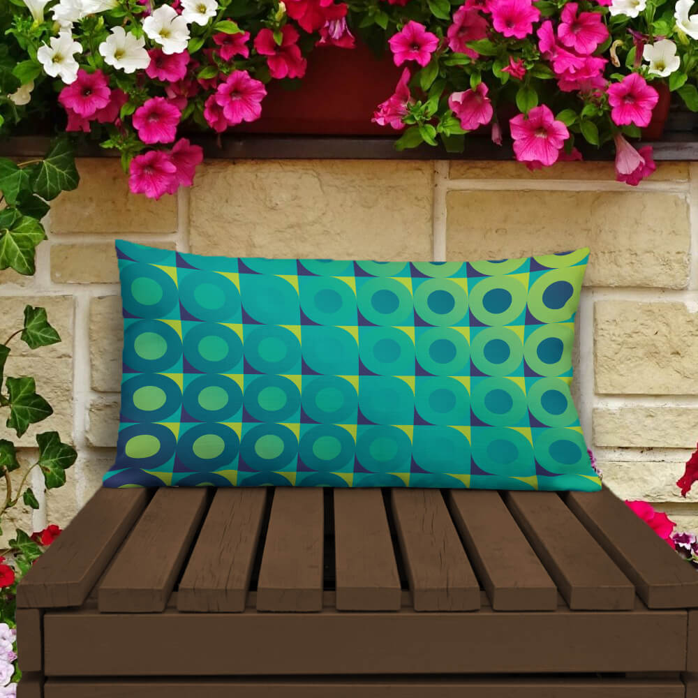 Mid Century Modern Aqua Green LifeSavers 20" x 12" Rectangular Throw Pillow on a patio bench
