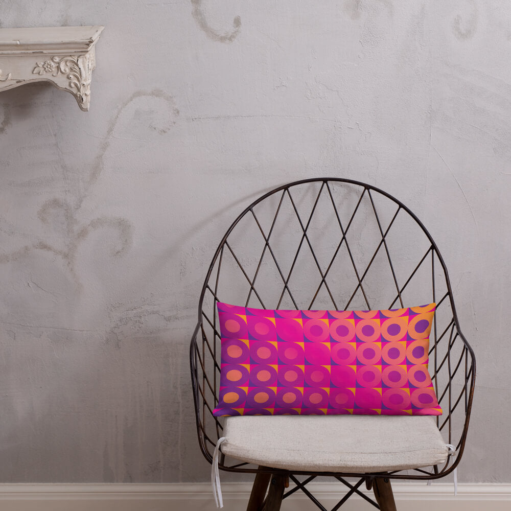 Mid Century Modern Orange Pink LifeSavers 20" x 12" Rectangular Throw Pillow on a chair