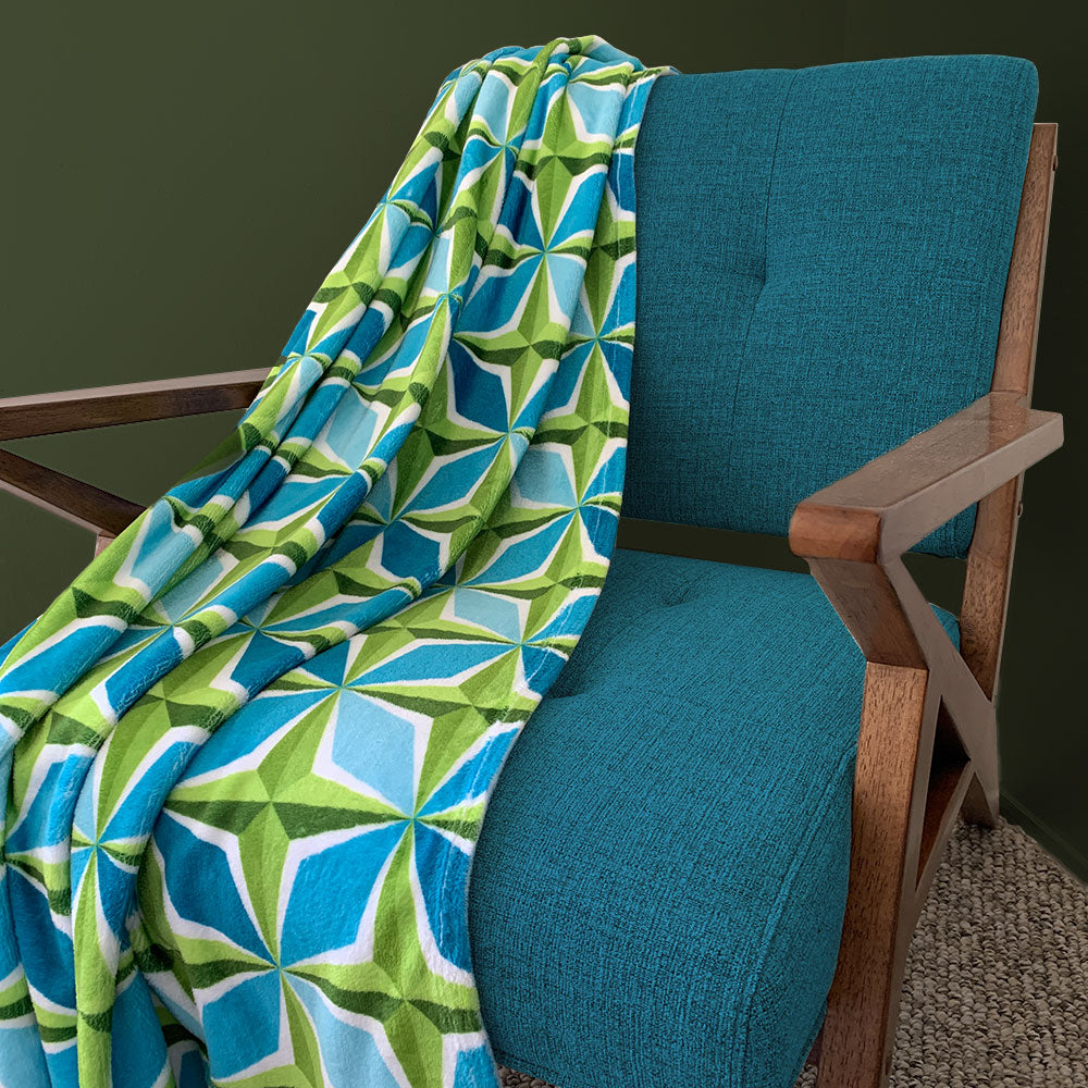 Mid Century Modern Aqua Green PolaRise Throw Blanket on a chair