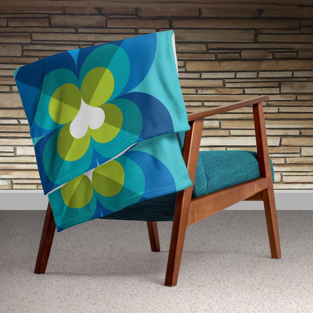 Mid Century Modern Aqua Blue LoverLeaf 50" x 60" Throw Blanket on an armchair