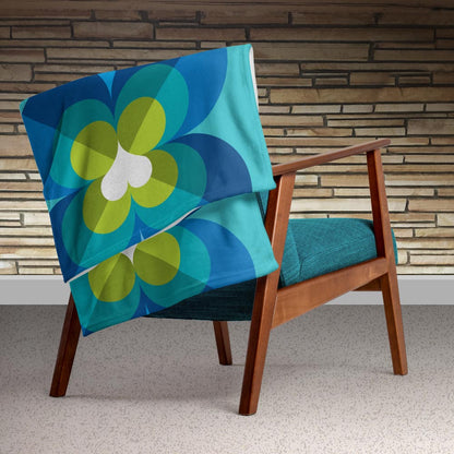 Mid Century Modern Aqua Blue LoverLeaf 50" x 60" Throw Blanket on an armchair